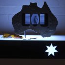 Screen Idol (Australiana) Wake Up and Puke, Acrylic lightbox material, glass , coins , timber, LCD screen, DVD video with sound, H 15cm W 70cm D 55cm, 2006