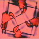Frame from Video MetaProgramming One. Colourised computer generated Lissajous and feedback. (1974)