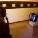 The TV Buddha installed at the AGNSW (1976). (video still from photograph: Stephen Jones)