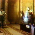 Paik and Moorman during a performance of the TV Cello in the entrance hall of the AGNSW (video still from photograph: Stephen Jones)
