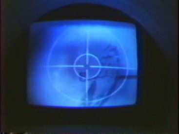 The viewing monitor with an image of Malcolm Fraser printed onto one of the balloons in a cctv camera shot.