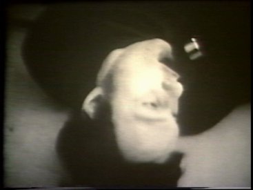 Still from Sequence 10 of Idea Demonstrations. Mike Parr holds his breath for as long as possible.